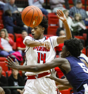 Senior Darrion Wimsatt passes the ball of the head of a defender. (